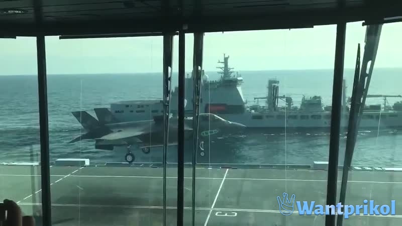 He sits down on an aircraft carrier. Video joke