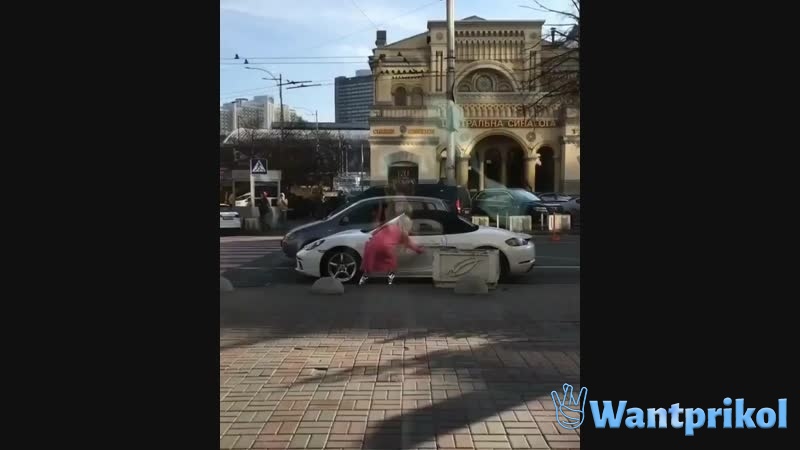 A girl crashes a Porsche. Video joke